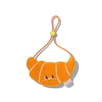 Orange croissant-shaped dog bib for small dogs and cats on white background

